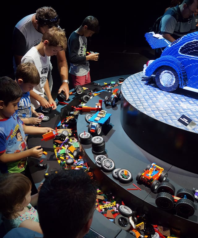 People building at the LEGO stations